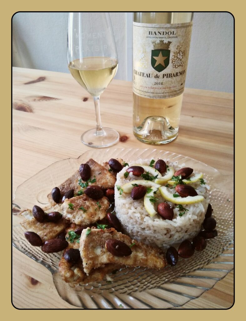 Lebanon fish Sayadieh with rice along with a white Bandol C.D.O.