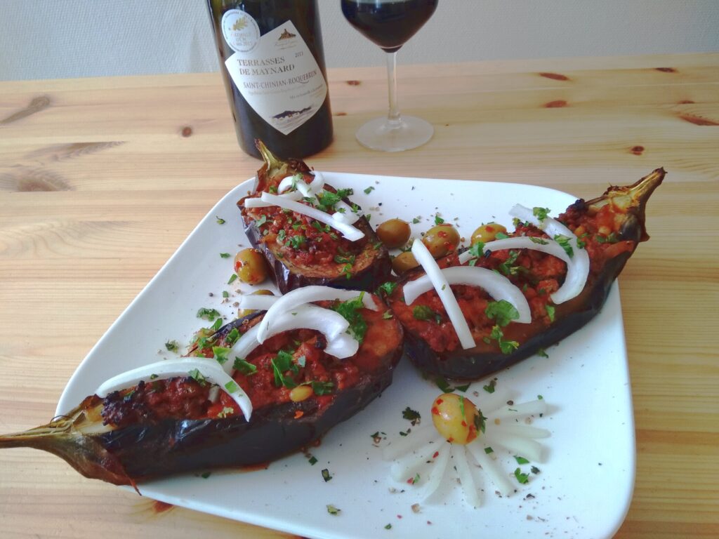 A Turkish eggplant recipe called Imam Bayildi along with a red wine from Languedoc Roussillon in France.