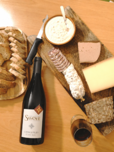French charcuterie board served with Chiroubles red wine